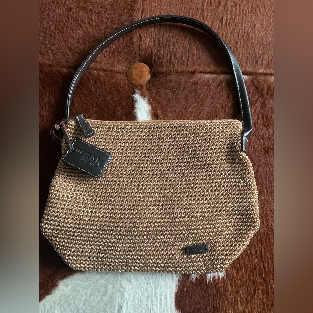 The Sak by Elliott Lucca boho chic crotchet hobo purse with leather handles.